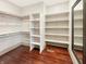 Walk-in closet provides extensive storage space with custom shelving and clothing racks at 1412 10Th St, Danville, IN 46122