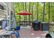 Relaxing deck area with seating, grill, and peaceful wooded views for outdoor enjoyment at 1413 N Lost Lake Rd, Columbus, IN 47201