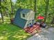 A-frame home with a spacious deck and outdoor area, ideal for lakeside relaxation and entertaining at 1413 N Lost Lake Rd, Columbus, IN 47201