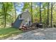A-frame home with outdoor deck, seating, and peaceful wooded views for outdoor enjoyment at 1413 N Lost Lake Rd, Columbus, IN 47201