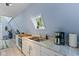 Efficient kitchen features granite countertops, stainless sink, and a charming window at 1413 N Lost Lake Rd, Columbus, IN 47201