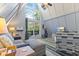 Inviting living room with vaulted ceilings, large windows and comfortable seating with deck access at 1413 N Lost Lake Rd, Columbus, IN 47201