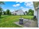 Inviting backyard with green grass, a patio area with outdoor furniture, and a view of the home's exterior at 15523 Follow Dr, Noblesville, IN 46060