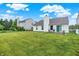 Lush backyard featuring a well-maintained lawn, a patio with outdoor seating, and the home's exterior at 15523 Follow Dr, Noblesville, IN 46060