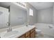 Bright bathroom with double vanity, large mirror, and soaking tub at 15523 Follow Dr, Noblesville, IN 46060