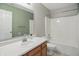 Well-lit bathroom featuring a shower-tub combo, a functional toilet, and a standard sink and vanity at 15523 Follow Dr, Noblesville, IN 46060