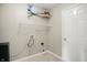 Practical laundry area with shelving for storage and washer/dryer hookups at 15523 Follow Dr, Noblesville, IN 46060