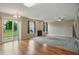 Open living room with sliding glass doors to backyard, a ceiling fan, and a fireplace at 15523 Follow Dr, Noblesville, IN 46060