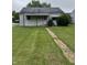 Charming single-story home with a well-maintained lawn and inviting front porch at 1609 N Outer Dr, Lebanon, IN 46052