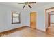 Bedroom with hardwood floors, closet, and large window with lots of natural light at 1613 Park Rd, Anderson, IN 46011