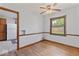 Cozy dining room with hardwood floors, chair rail accents, and an open view to the kitchen area at 1613 Park Rd, Anderson, IN 46011