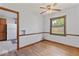 Dining room with hardwood floors, neutral decor, chair rail detail, and ample natural light at 1613 Park Rd, Anderson, IN 46011