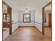 Bright dining room featuring hardwood floors, chair rail molding, and natural light from the backyard at 1613 Park Rd, Anderson, IN 46011