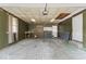 Spacious garage featuring concrete floor, work bench, and storage possibilities at 1613 Park Rd, Anderson, IN 46011