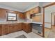 Functional kitchen featuring wood cabinets and countertop workspace at 1613 Park Rd, Anderson, IN 46011