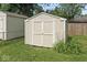 Exterior view of shed, featuring neutral color scheme, and grassy surroundings at 1613 Park Rd, Anderson, IN 46011
