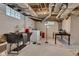 Unfinished basement with laundry area and utility sink at 1618 Villa Ave, Indianapolis, IN 46203