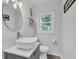 Bright bathroom features a vessel sink, modern fixtures and a large window allowing for natural light at 1618 Villa Ave, Indianapolis, IN 46203