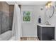 Bathroom features a tile shower and tub, with a modern vanity at 1618 Villa Ave, Indianapolis, IN 46203