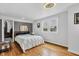 Sun-filled bedroom with wood floors, neutral paint scheme and ceiling fan at 1618 Villa Ave, Indianapolis, IN 46203