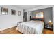 Bedroom offers neutral color scheme and wood floors at 1618 Villa Ave, Indianapolis, IN 46203