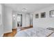Bright bedroom with wood floors has access to the ensuite bath at 1618 Villa Ave, Indianapolis, IN 46203