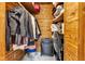 Well-organized closet with wooden shelving and rods providing ample storage space at 1618 Villa Ave, Indianapolis, IN 46203