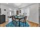 Bright dining area with modern table, seating, stylish lighting, and an open layout at 1618 Villa Ave, Indianapolis, IN 46203