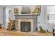 Living room fireplace featuring a gray mantel, decorative tile, and a cozy ambiance at 1618 Villa Ave, Indianapolis, IN 46203