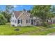 Charming two-story home featuring a stone chimney, blue shutters, and a well-maintained lawn at 1618 Villa Ave, Indianapolis, IN 46203