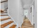 Hallway and staircase feature wood and white color scheme at 1618 Villa Ave, Indianapolis, IN 46203