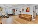 Bright living room boasts hardwood floors, fireplace with mantel, and a cozy seating area at 1618 Villa Ave, Indianapolis, IN 46203