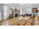 Bright living room boasts hardwood floors, fireplace with mantel, and a cozy seating area at 1618 Villa Ave, Indianapolis, IN 46203