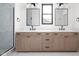 Bathroom with a double sink vanity, with a large mirror and modern black fixtures at 1654 Fernley Dr, Westfield, IN 46074