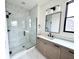 Bathroom with a large marble tile shower, a single sink vanity, and modern lighting at 1654 Fernley Dr, Westfield, IN 46074