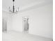 Bright bedroom with a modern lighting fixture, all white interior, and closet door at 1654 Fernley Dr, Westfield, IN 46074