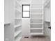 Walk-in closet with white shelving and black hardware and window with natural light at 1654 Fernley Dr, Westfield, IN 46074