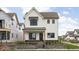 Charming two-story home with a white exterior, landscaped front yard, and covered porch at 1654 Fernley Dr, Westfield, IN 46074