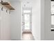 Inviting hallway with a coat rack and a view of the front door at 1654 Fernley Dr, Westfield, IN 46074