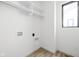 Laundry room featuring a window, modern shelving, and convenient hookups at 1654 Fernley Dr, Westfield, IN 46074