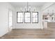 Open-concept living area features hardwood floors, modern windows, and bright natural light at 1654 Fernley Dr, Westfield, IN 46074