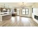 Open living space with kitchen, fireplace, modern lighting and expansive view of the neighborhood at 1654 Fernley Dr, Westfield, IN 46074