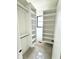 Bright walk-in closet featuring custom shelving, a hanging rod, and neutral carpeting at 1654 Fernley Dr, Westfield, IN 46074