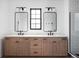 Bathroom featuring double sink vanity with two mirrors, black hardware, and tiled walk-in shower at 1655 Carrollton Rail Dr, Westfield, IN 46074