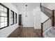 Bright entryway features a staircase with wood railing and open concept design leading to multiple rooms at 1655 Carrollton Rail Dr, Westfield, IN 46074