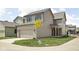 Beautiful two-story home with a attached two-car garage and manicured front lawn at 1655 Carrollton Rail Dr, Westfield, IN 46074
