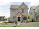 Charming two-story home featuring mixed brick and siding, professional landscaping and inviting entryway at 1655 Carrollton Rail Dr, Westfield, IN 46074