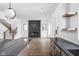 Open floor plan with hardwood floors and a modern kitchen, island, stainless steel appliances at 1655 Carrollton Rail Dr, Westfield, IN 46074