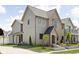 An expansive view of this two-story home, showing a fenced yard and complementing the exterior colors at 1655 Carrollton Rail Dr, Westfield, IN 46074