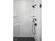 Walk-in shower features a black shower head and white subway tiling, black fixtures, and a glass door at 1655 Carrollton Rail Dr, Westfield, IN 46074